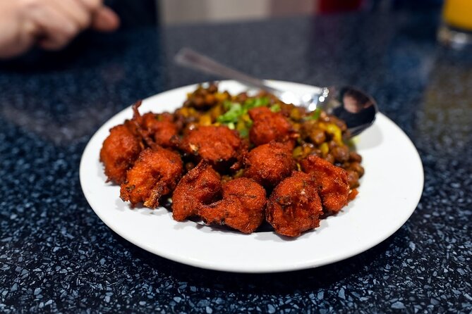 East London Indian Food Tour with 8+ Authentic Food Tastings - What you actually eat: curries, tandoori, naan, pakoras, lassi, sweets, and that secret dish