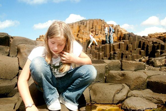Giant’s Causeway and Titanic Experience from Belfast Port - Dunluce Castle cliffs, quick stop, big payoff
